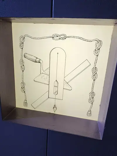 fil à plomb, règle et truelle